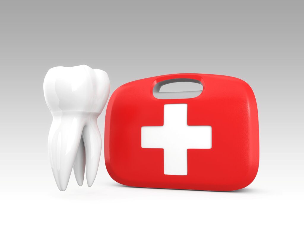 Rendering of large model tooth next to red emergency kit with off-white background